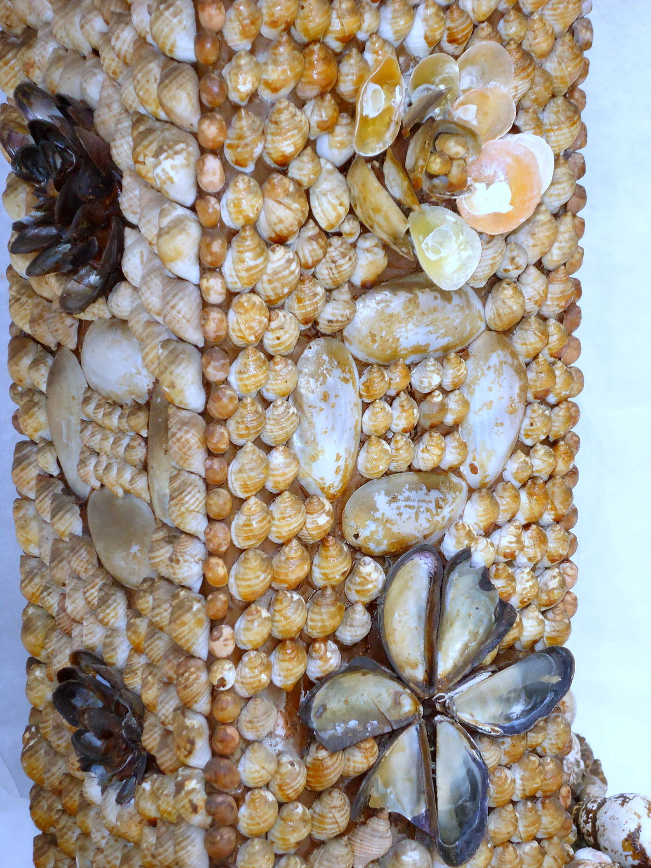 Extraordinary Folk Art shell table or console created in the late 19th-early 20th century from the coast of Maine. 
The star and two hearts on the top of the table are composed of shells standing upright in contrast to the surrounding periwinkles