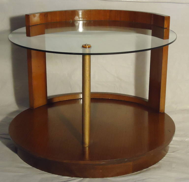 Gilbert Rohde walnut coffee table for Herman Miller rare.
An unusual form because of the cutout back.
The vintage glass shelf rests on a copper clad dowel support. 
The table could also be used as a low end or side table.
It is in good vintage