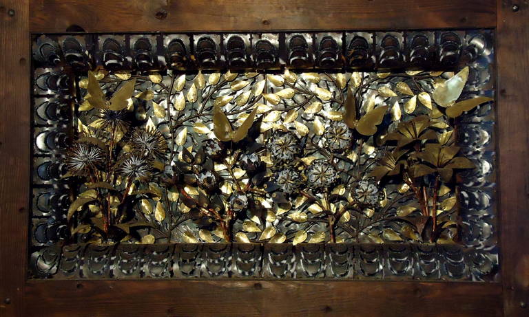 Complex overlays of brass, iron and copper make this Butterfly garden an interesting execution of metal surfaces. Presented in a heavy wooden frame with a secondary pierced iron arabesque surround of circlets of thin steel. in the style of Silas