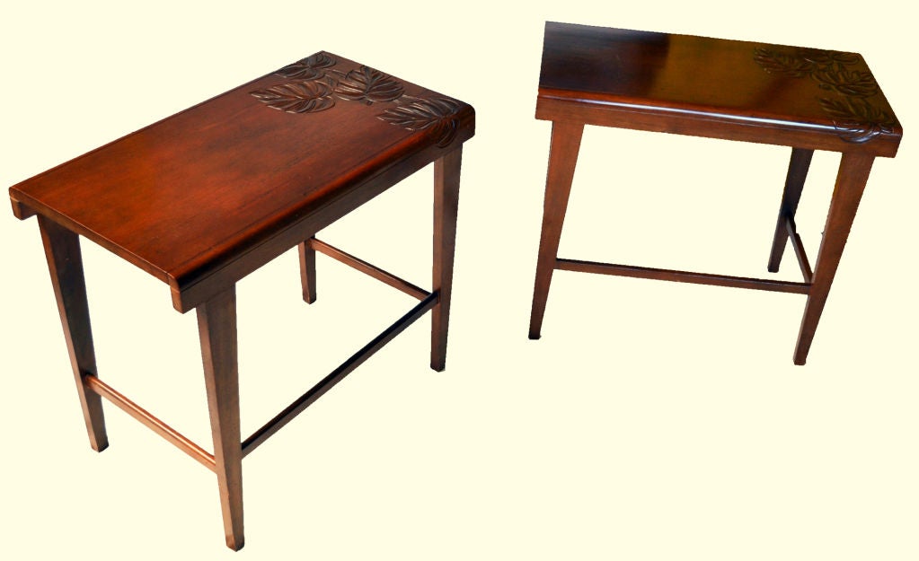 Matched pair of end tables carefully constructed of Koa wood with skillfully carved leaves decorating one end.<br />
We have a matching coffee table - check our storefront for details.