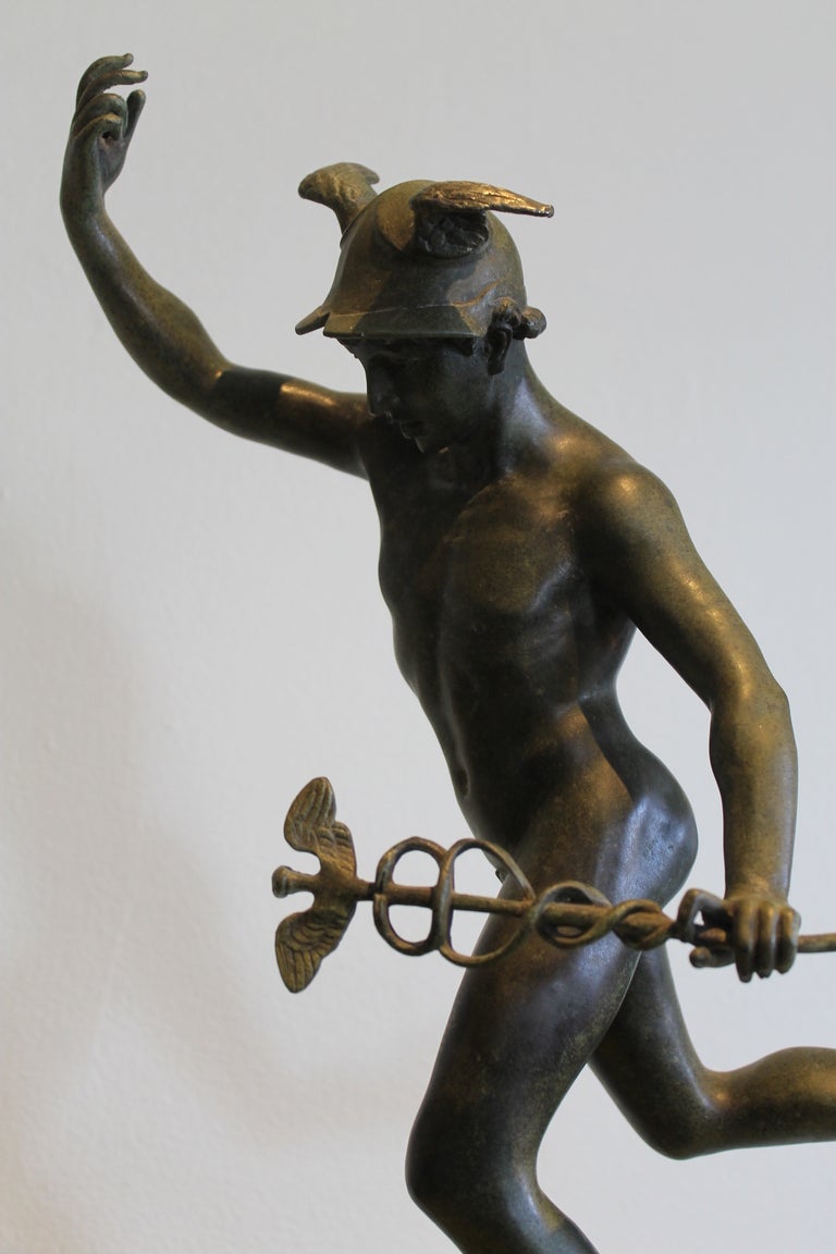Cast bronze statue of mercury with marble base.  Base is 5.5