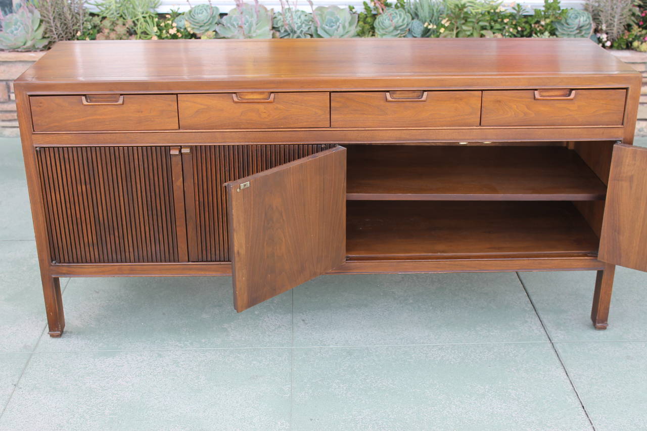 Circa 1960's sleek and handsome credenza by Drexel in walnut. This is from their 