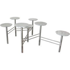 Seven Surface Articulated Pedestal Table