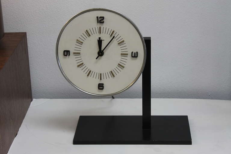 Telechron clock by General Electric.  Great working condition for an iconic clock.  Clock was called 'The Innovation', model 8H27,  produced in the 1950's.  It was a free-hanging clock but now temporarily mounted.  Check out link