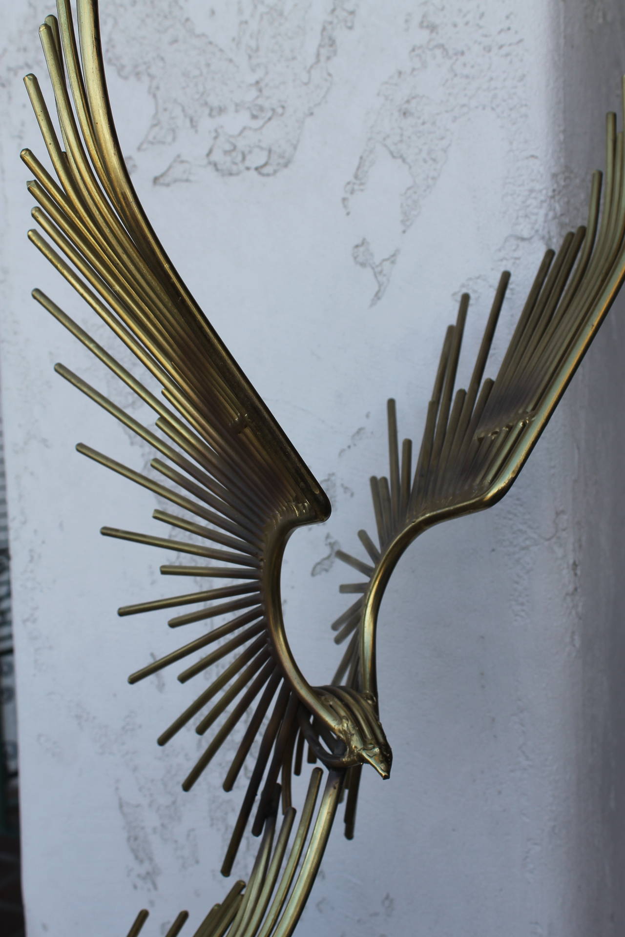Monumental brass plated steel sculpture by Curtis Jere titled Eagles in Flight.  From the “Eagles in Flight