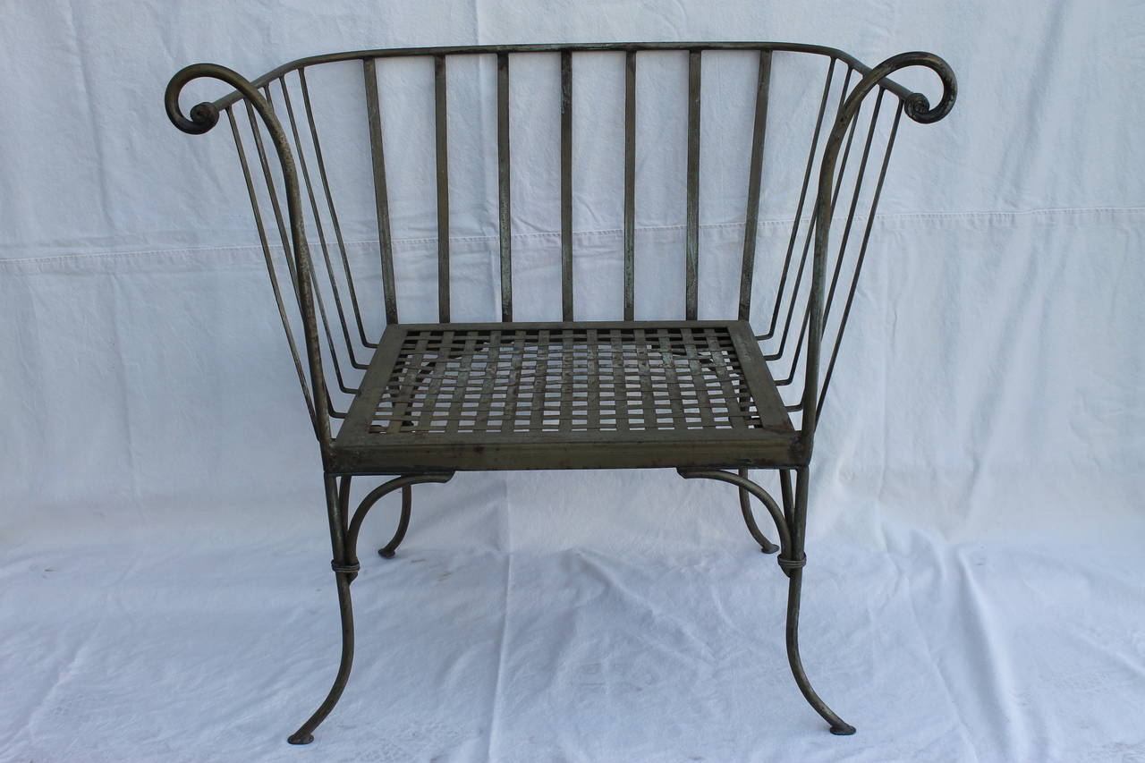 Pair of wrought iron patio lounge chairs.  These are the largest and most elegant I've seen in years.  Not sure of the designer or manufacturer but, reminiscent of Salterini patio furniture.  They are 24.5