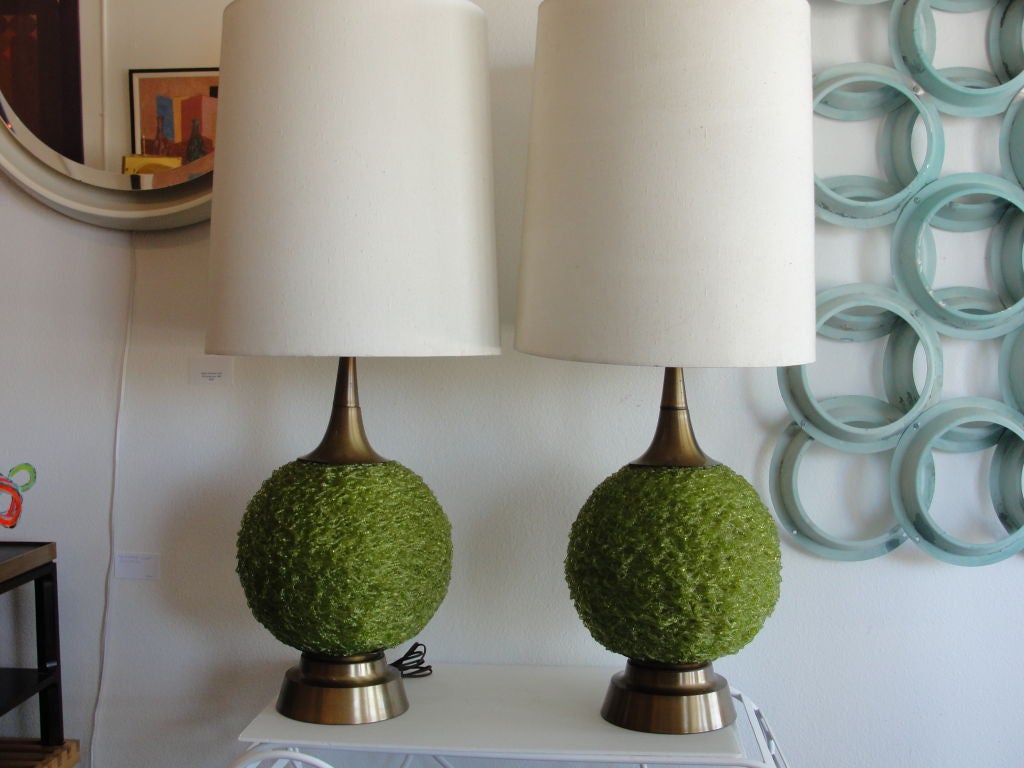 Pair of green Spaghetti lamps.  3 way light switch lets you either light up the green ball, the top or both.  Measures 3' from base to finial.  The green spaghetti balls measure 12