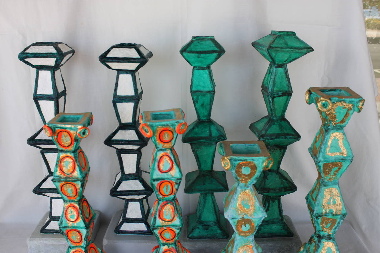 Collectiom of Martha Daniels hand built, fired, glazed, painted ceramic candlesticks.  Height ranges from 13.5