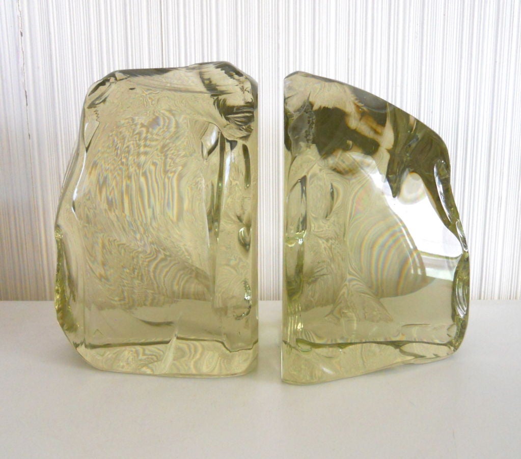 A pair of heavy chipped finish glass bookends in pale Topaz, acid etched FONTANA ITALY and hand signed FX. Designed by Max Ingrand.