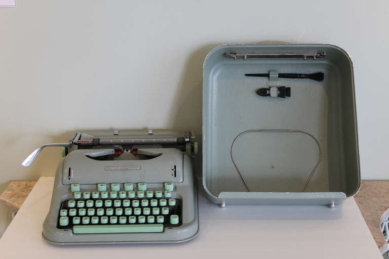 Portable typewriter, complete with original operating manual.  Manufactured by E. Paillard & Co., date 1958-66