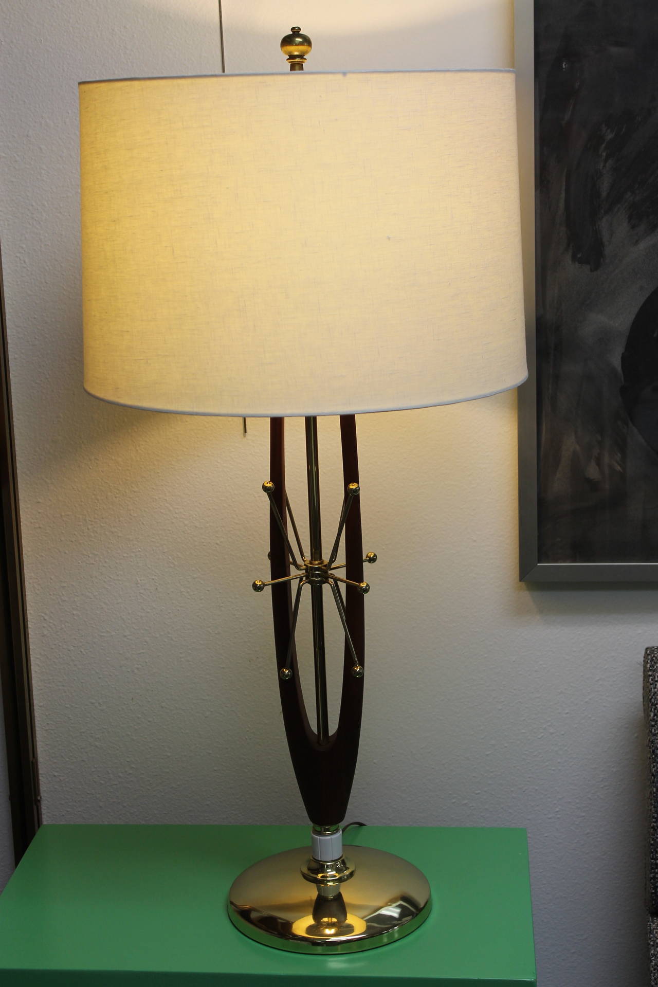 Incredible starburst/sputnik brass plated steel table lamp.  This lamp has been totally restored and rewired.  Base measures 9" diameter.  Wood portion is 20.5" high.  Height from base to the bottom of socket is 25".  Lamp shade not