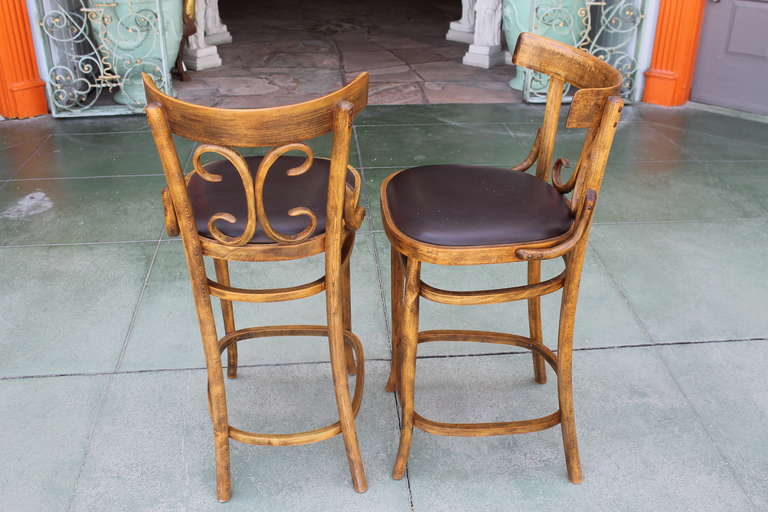 Two rare barstools in the Thonet style of bentwood construction with upholstered seats. Made in Italy by the Otto Gerdau Company. Original labels remain. Excellent condition, solid and sturdy.