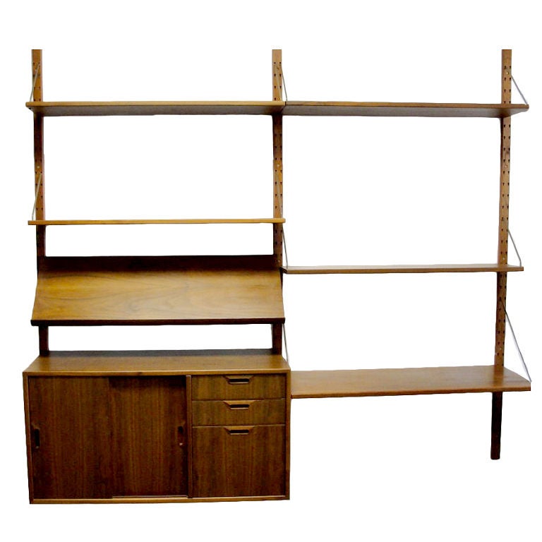 Cado System by Poul(Paul)Cadovius. Made in Denmark. Consisting of teak shelves (not pressboard) and brass hardware measuring 79