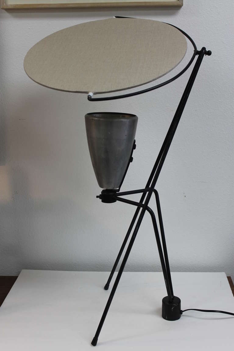 Modified table lamp by Mitchell Bobrick.  This lamp has been modified, meaning the ceramic cone is now aluminum and the fiberglass reflector is fabric.  The reflector is 15