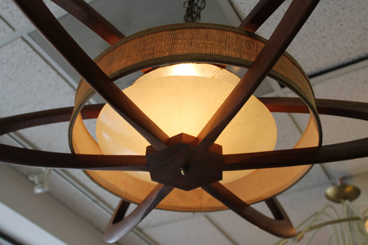 Beautiful teak chandelier in the style of Adrian Pearsall or Modeline.  All original and has been professionally rewired.  Chandelier is about 34