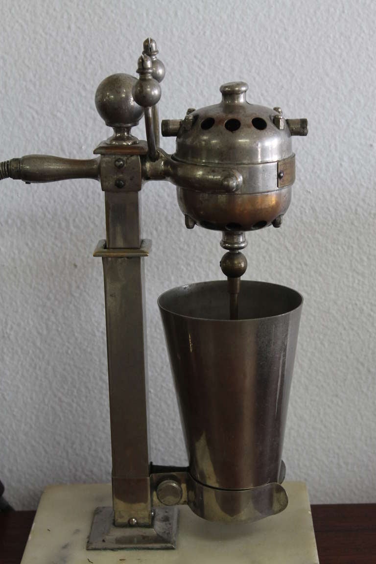 This is a 1911 Cyclone Hamilton Beach Drink Mixer - model number 1. Some interesting facts about this unit is that it's thought to be the oldest working appliance known to Hamilton Beach. They (HB) conducted a research project to see what the oldest