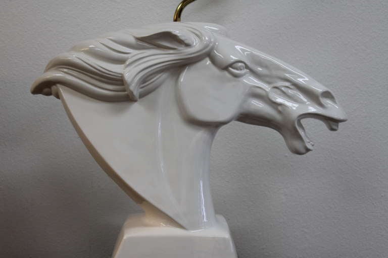 Ceramic horse head lamp on a Lucite base. Lamp is 22