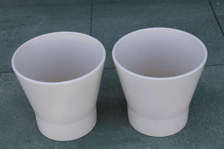 Pair of Vintage Gainey Pottery Garden Pots. A matched pair of matte off-white glazed garden pots by Gainey. These are a seldom seen form. 14” high and 15” wide. Excellent condition. Clearly stamped inside bottom of each pot.  There are some slight