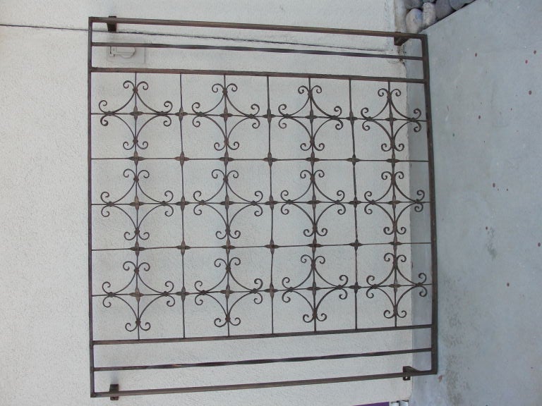 Wrought Iron window grill from Albuquerque, New Mexico, circa 1930's.  A frame was added to the grill. 
Frame is 44