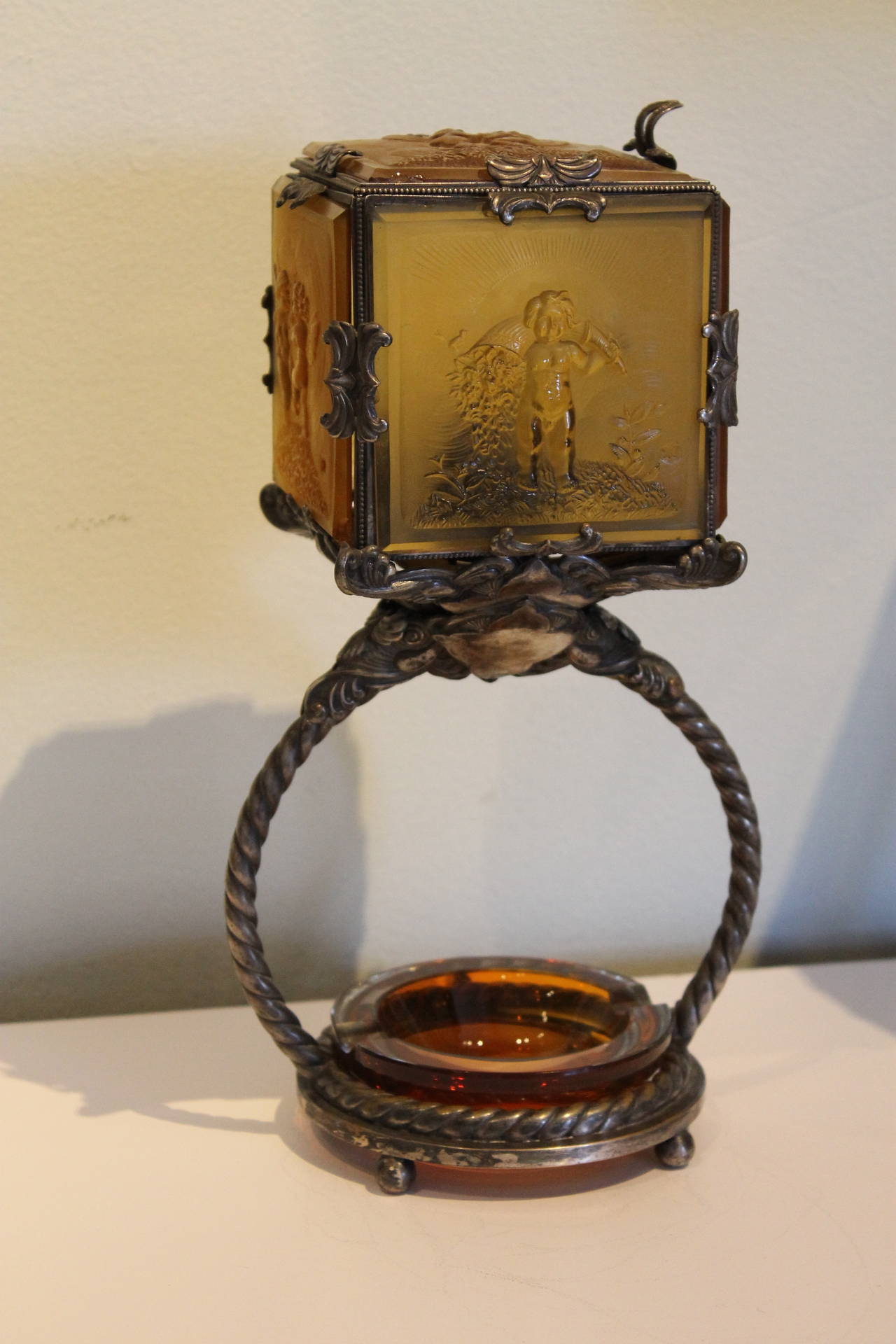 Extremely rare Heinrich Hoffmann Art Nouveau lamp. Quite possibly the only known example, this ultra-scarce circa 1920's lamp features five different bas-relief glass panels depicting winged fairies with birds. The color is a soft amber. The amber