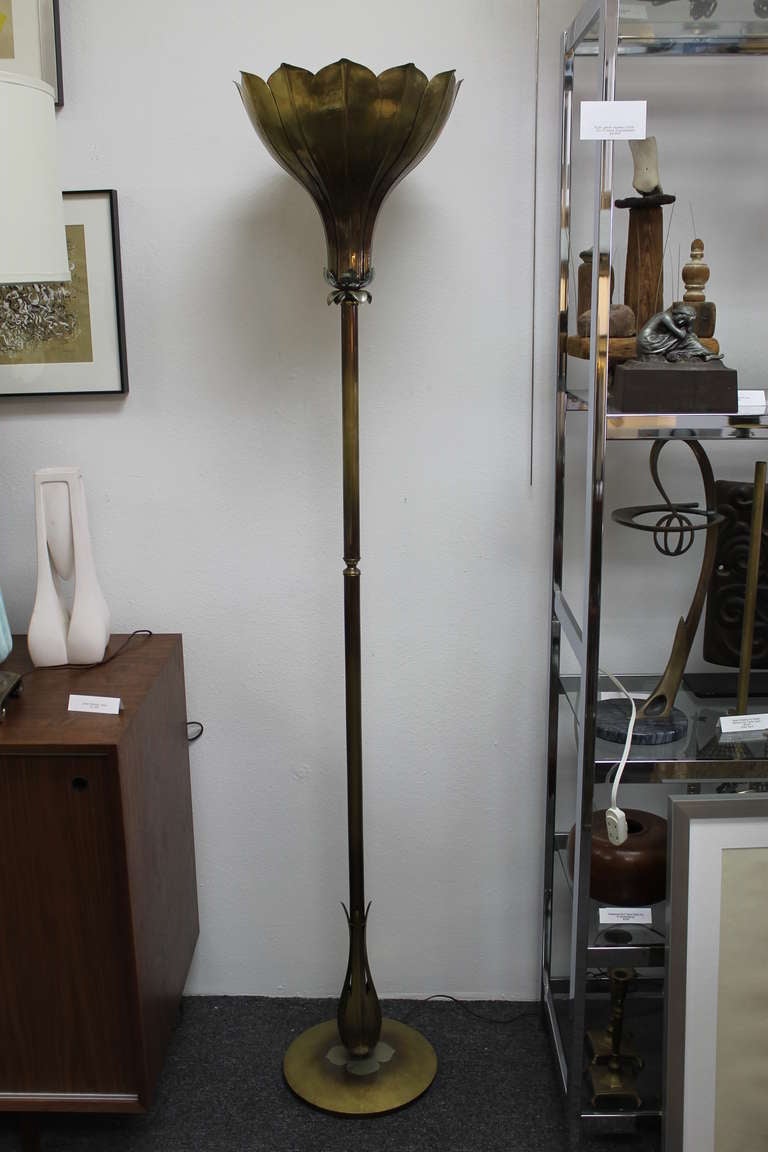 Hand made torchiere by Norman Grag of Grag Studios designed especially for Gumps in San Francisco.  Brass patina finish with mixed metal accents.  Lamp measures 72