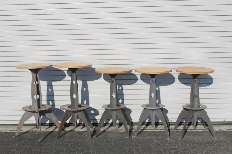 Five stools shaped like rockets. Reminiscent of the steampunk movement. The 2 larger stools are 30