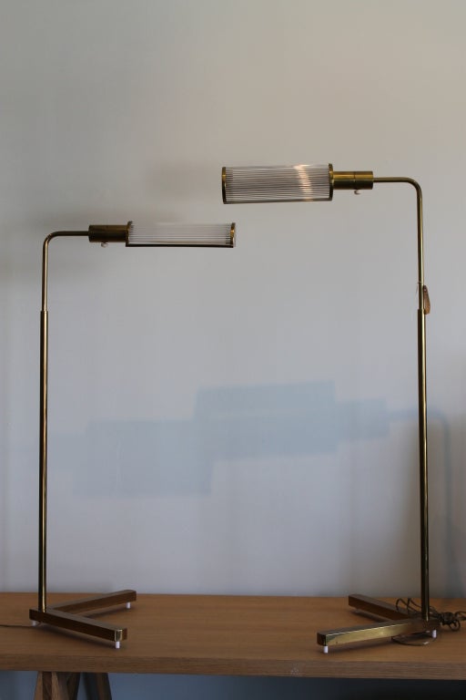 Pair of adjustable brass and glass Casella Floor Lamps, California.