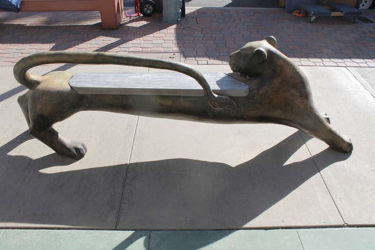 Monumental patinated bronze and wood seat panther bench measuring 29.5