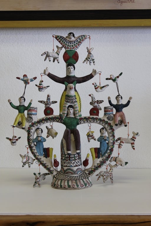 Rare Heron Martinez Mendoza (Acatlan, Mexico) white period Tree-of-Life candlestick with animals and performers.  Heron Martinez Mendoza, who died in 1990, was one of Mexico's greatest ceramists and masters of folk art. He produced his most sought