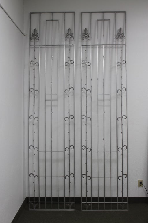 Pair of Aluminum security gates from Ohio.  Attributed to Wendell August.  Dimensions listed below are for each panel