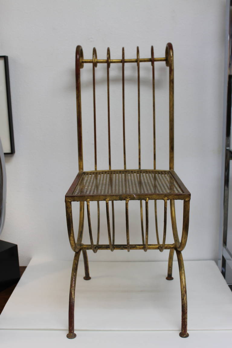 Stylish metal chair with original gold and reddish patina.  Chair measures 13.5