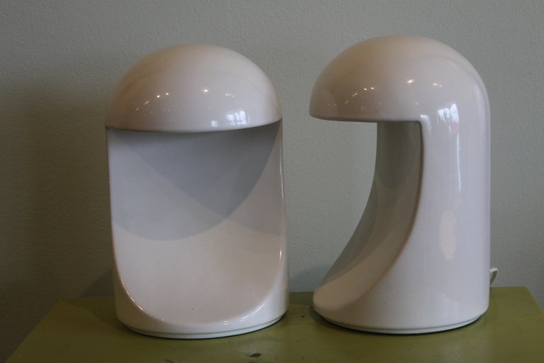Pair of Gabbianelli “Longobarda” lamps designed in 1966 by Marcello Cuneo (architect). This particular pair is dated 1969. High gloss white glazed ceramic. Professionally rewired with in-line on/off switches.  Lamps are 10” high and 6 1/4” wide