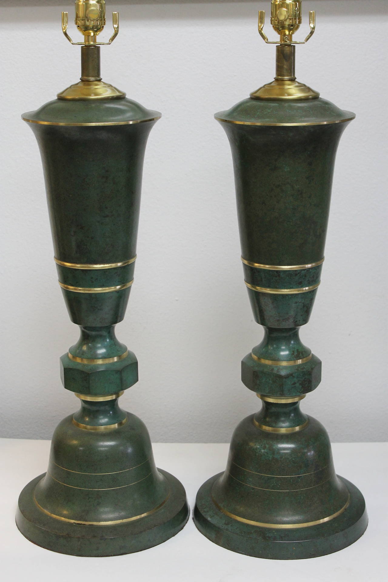 A wonderful pair of bronze and copper lamps attributed to Carl Sorensen. Lamps have been professionally rewired. Lamp measures 22.5