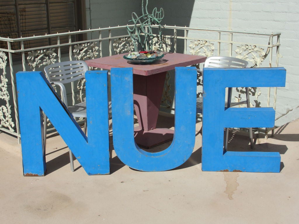 Tin sign, letters 'NUE'