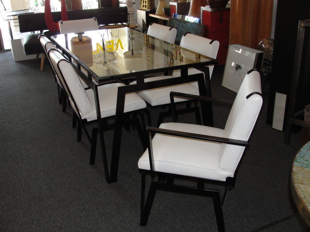 Walter Lamb patio/dining set by Pacific Iron Products consisting of table, 6 chairs.  Designed in 1949.  The set has been powder coated black and chairs have been reupholstered in white leather.