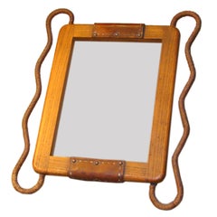 OAK AND LEATHER FRAME BY JACQUES ADNET