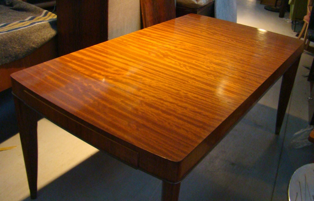 DE COENE FRERES Mahogany and golden bronze dining room table