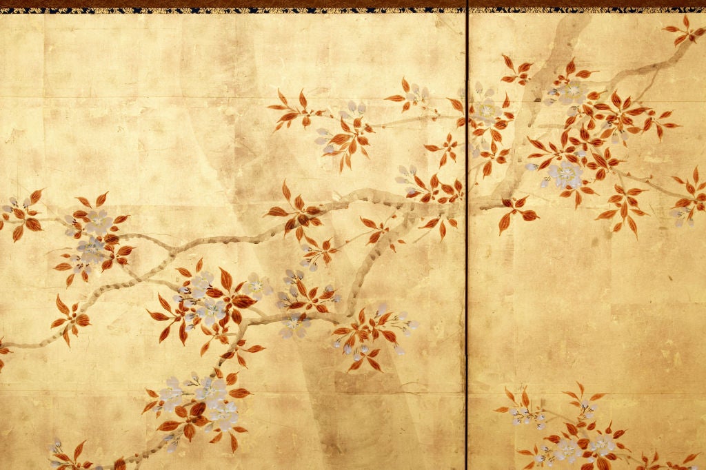 Six-panel folding screen with décor in ink, mineral colors and gofun on gold leaf of a cherry tree in full bloom and of flowering grasses.