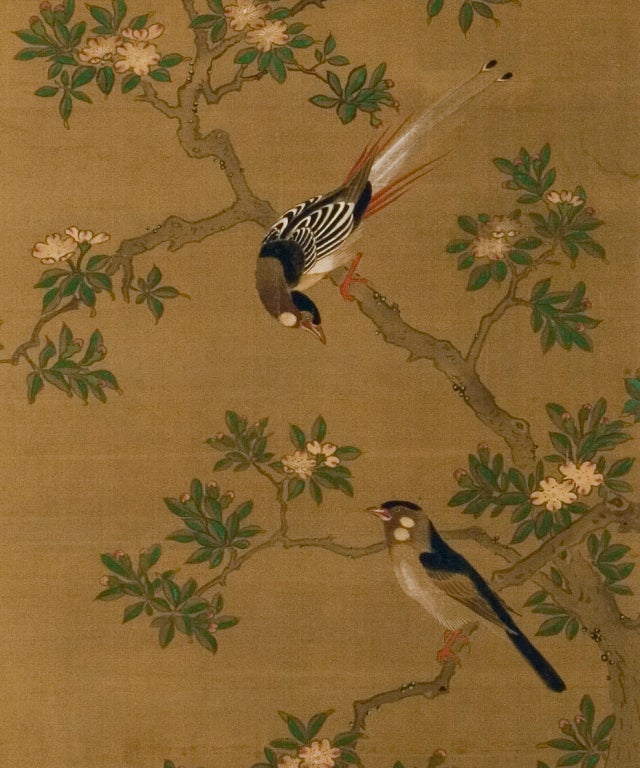 Two-panel folding screen with painting in ink and mineral colors on silk of birds in flowering trees.