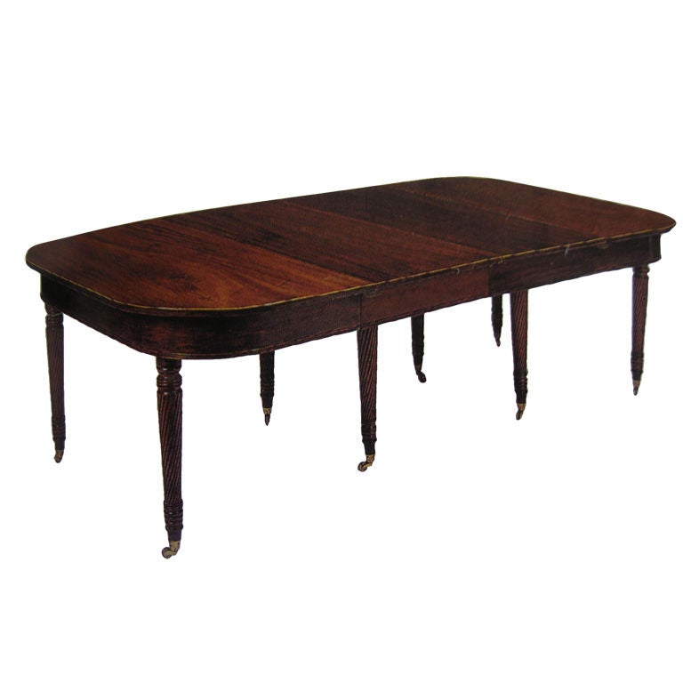 An English Regency Mahogany Dining Table An English Regency Mahogany Dining Table