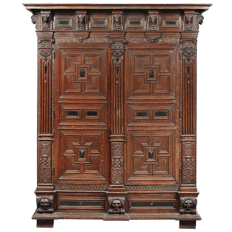 A Flemish Oak and Ebonised Cupboard For Sale