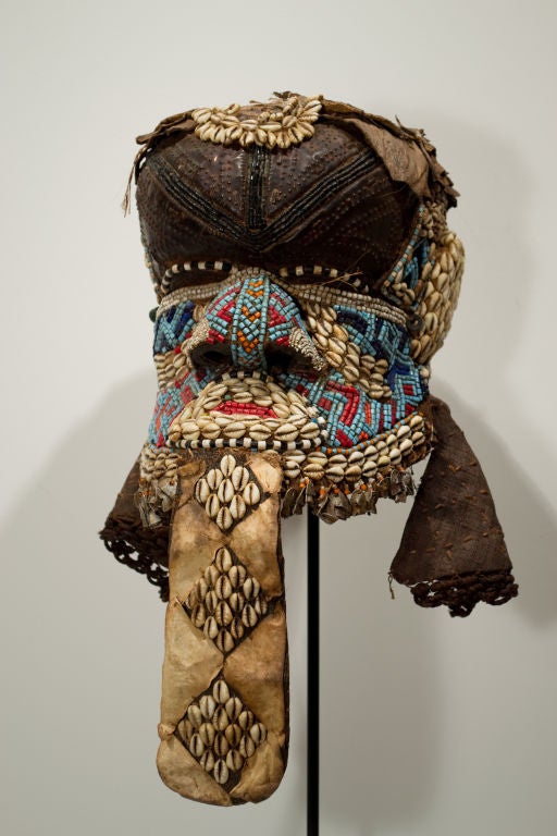 Beaded ceremonial helmet mask from Kuba tribe of Congo<br />
<br />
<br />
<br />
Keywords: African, Tribal, Ceremonial, Cameroon, headdress, cloth, beads, blue, red, brown, shells