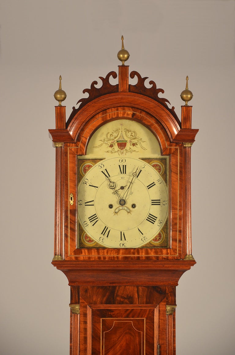 Roxbury case Massachusetts Federal inlaid tall case clock.   The dial with original paper label, “S. CURTIS, CLOCK DIAL MANUFACTURER, BOSTON.”  The arched bonnet is surmounted by the original pierced fretwork (one tiny chip) and plinths with three