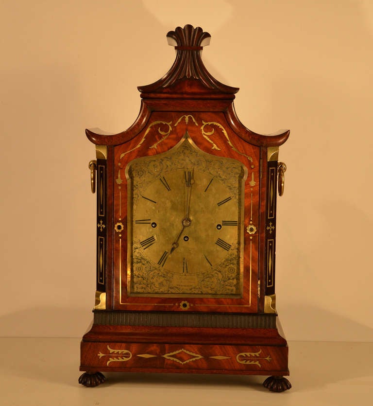 Absolutely superb English Regency mahogany bracket clock with brass inlay and music box works which rings an additional tune each quarter hour and strikes the hour.    
The brass dial is wonderfully engraved and signed, “Anderson   56 High Street,