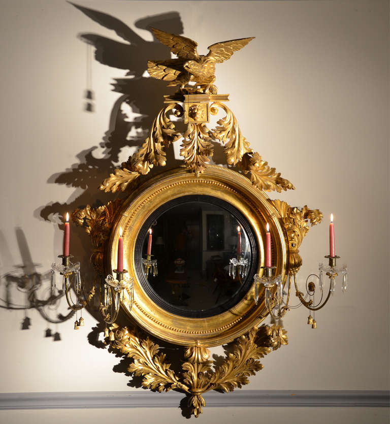 Superb large Regency gilded girandole mirror with bold eagle finial and fantastic whorl acanthus leaf decoration.

Four candle arms with additional paterae decoration.
 
All in wonderful original condition.