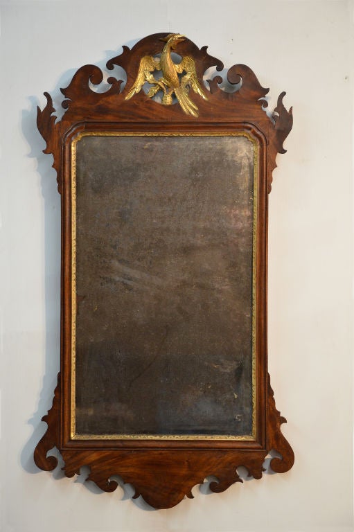 Fine mahogany Chippendale mirror with bold pierced Phoenix crest in wonderful original condition (including the glass and backboards).<br />
Circa:  1760-80