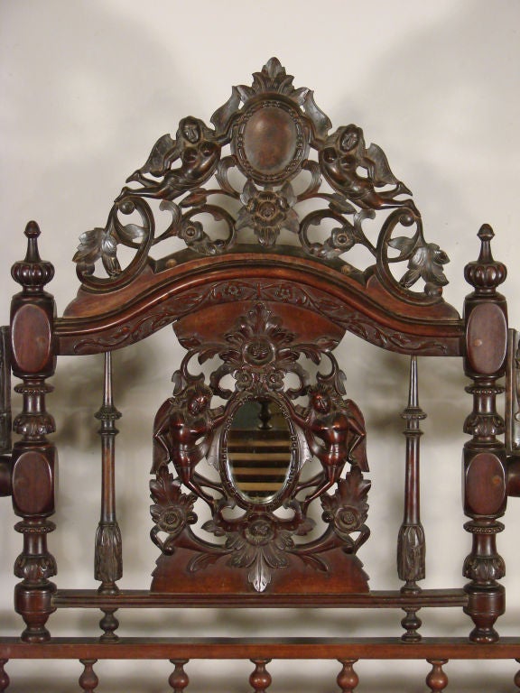 This Mahogany Bed is a superbly carved Anglo/Indian palace bed with great details.<br />
<br />
This mahogany four post canopy bed is outstanding in its execution and form. The bed has Barley Sugar twist posts with a carved canopy cornice. All the