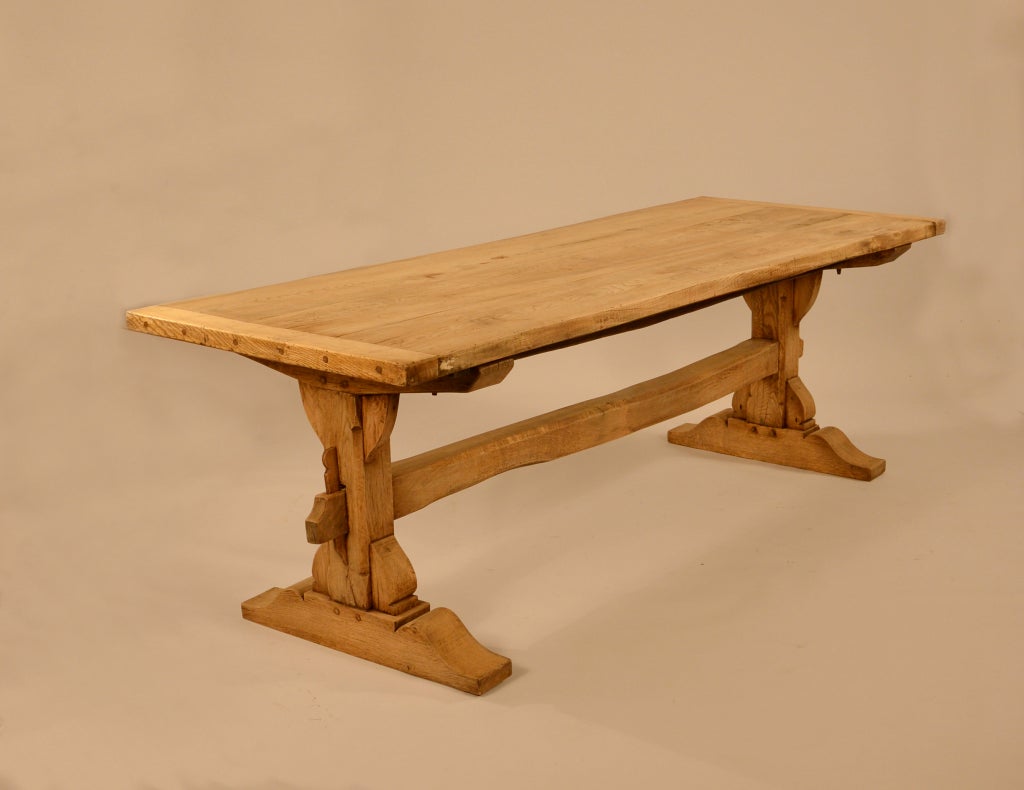 Wonderful Austrian trestle table in oak & elm.<br />
This trestle table has a great thick top all on sturdy shoe feet.<br />
This table is constructed with through wedging and pegged.