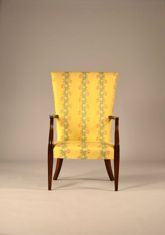 A Fine Boston Mahogany lolling chair. Chairs of this form with high upholstered backs, low over-upholstered seats, shaped arms and legs, are collectively called 