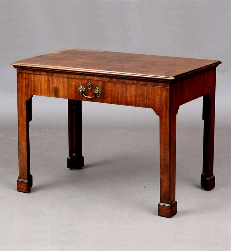 Superb Chippendale (early George III) architects table that is the epitome of the Chippendale aesthetic (stout and rooted to the floor).
The front legs split to slide out to support the drawer, all four legs retain the original inset columns, the